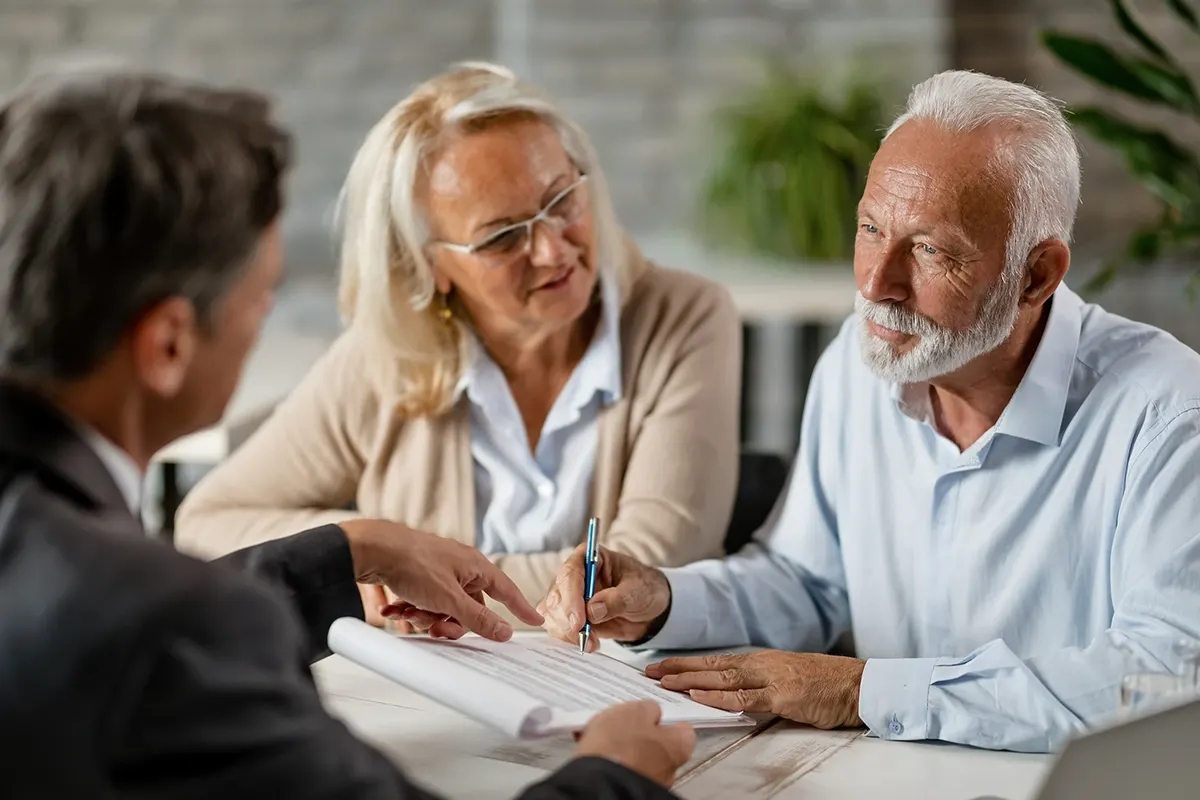 Attorney meeting with a couple to review documents